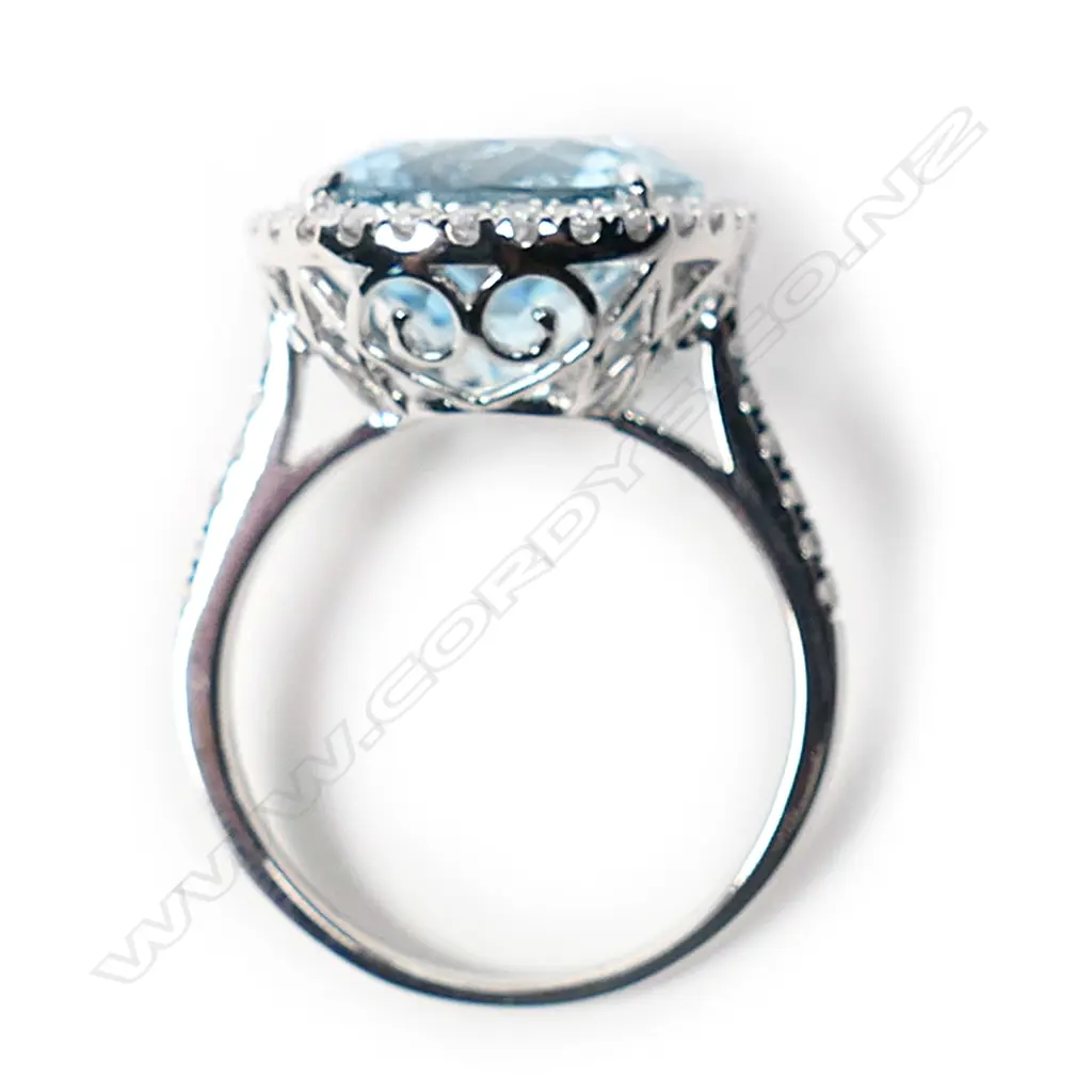 A 14ct white gold aquamarine and diamond halo cocktail ring, Image 1++
