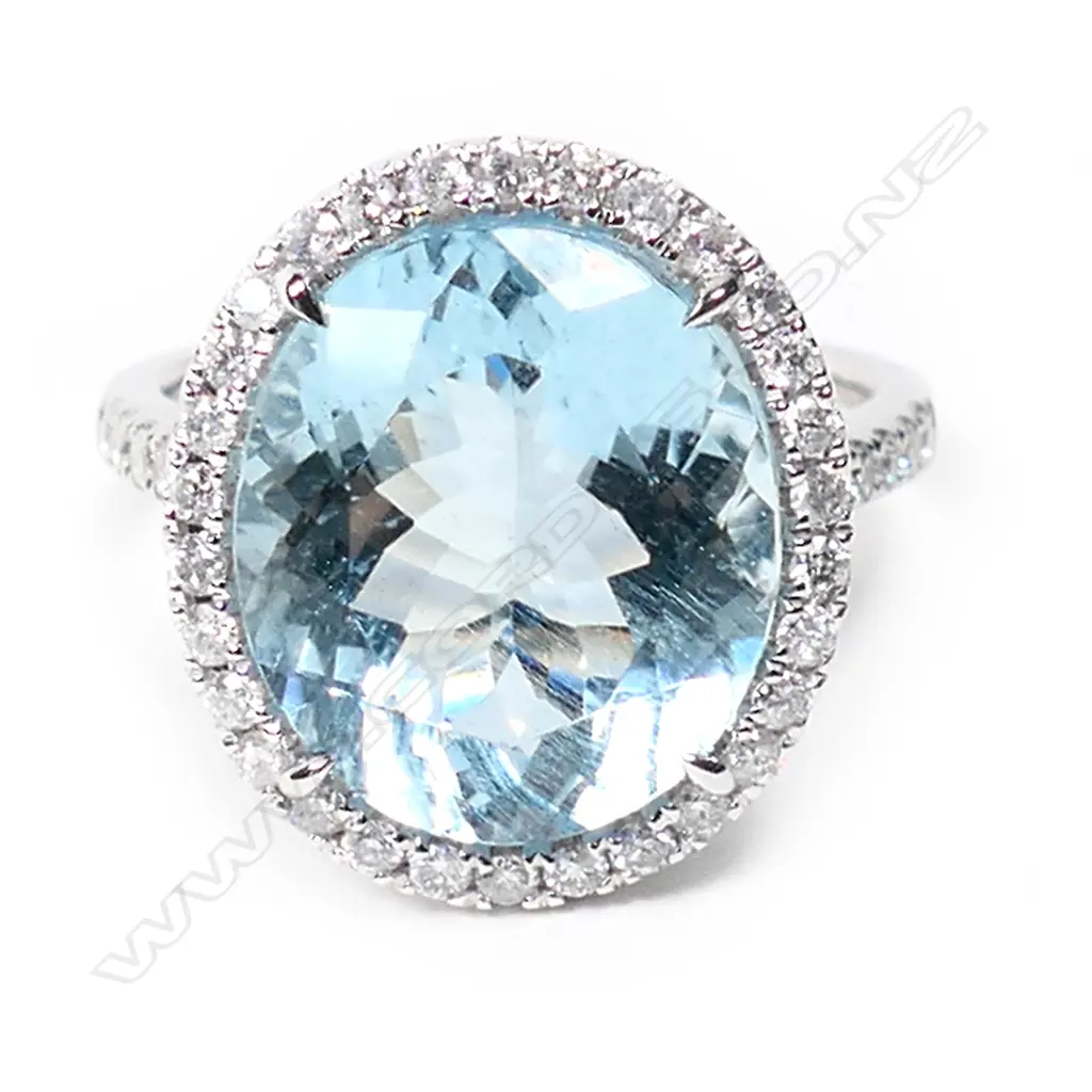 A 14ct white gold aquamarine and diamond halo cocktail ring, Image 1++