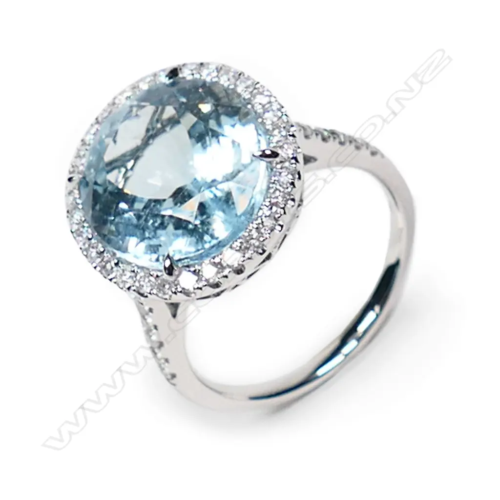 A 14ct white gold aquamarine and diamond halo cocktail ring, Image 1++
