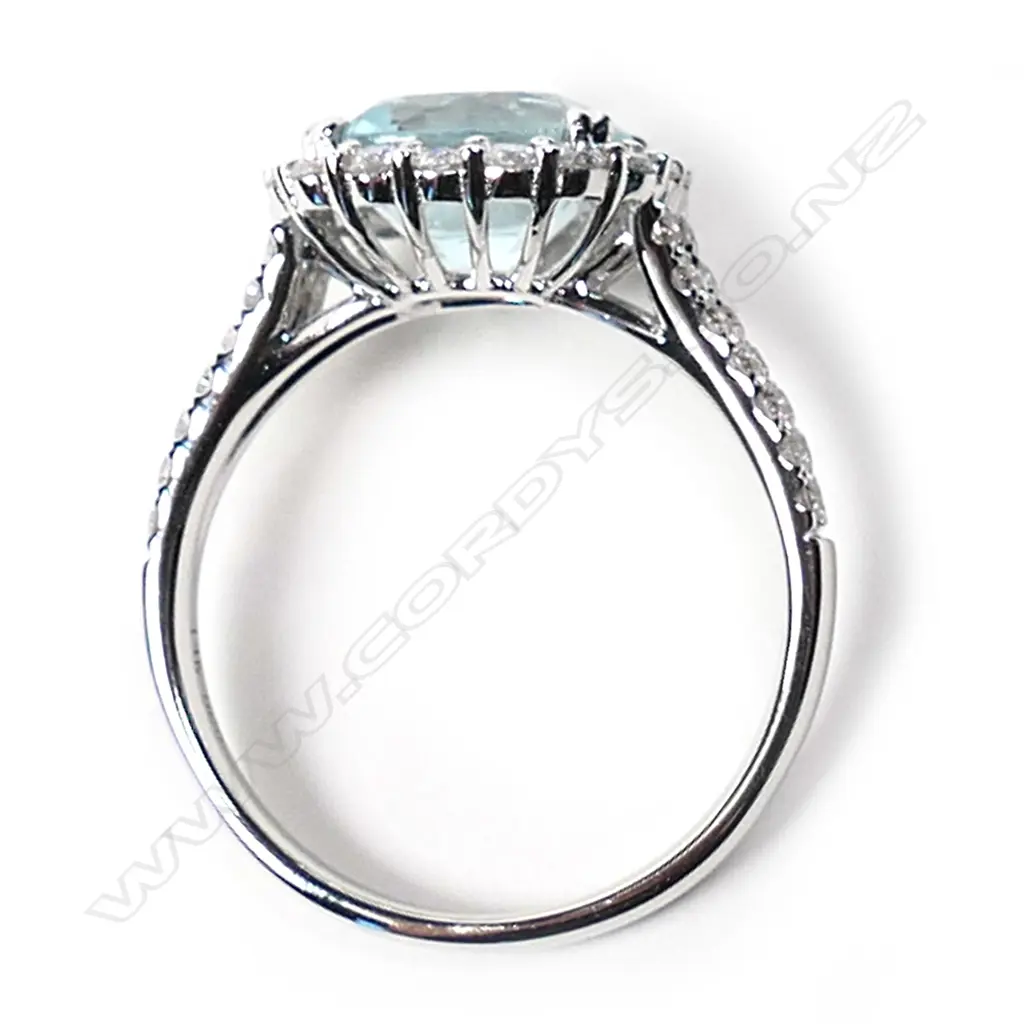 A 14ct white gold aquamarine and diamond vintage style halo ring, Image 1++