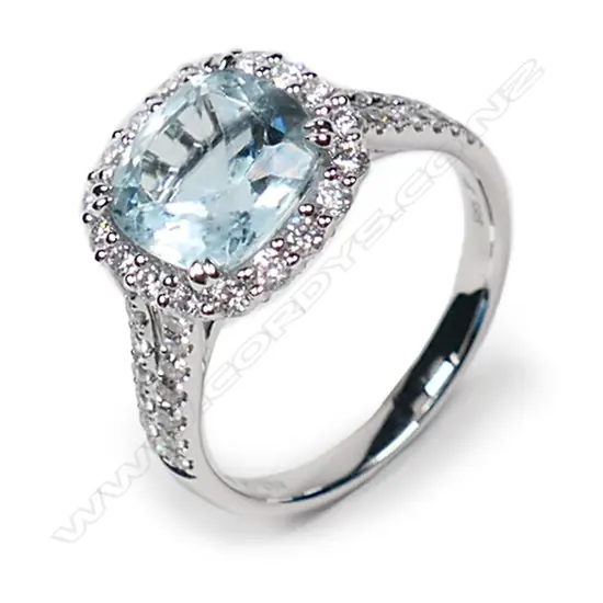 A 14ct white gold aquamarine and diamond vintage style halo ring,