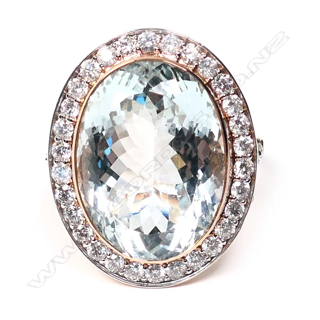 A 14ct rose gold aquamarine and diamond halo cocktail ring, Image 1++