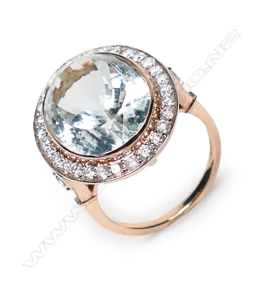 A 14ct rose gold aquamarine and diamond halo cocktail ring, Image 1++