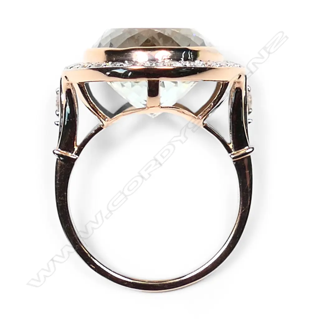 A 14ct rose gold aquamarine and diamond halo cocktail ring, Image 1++