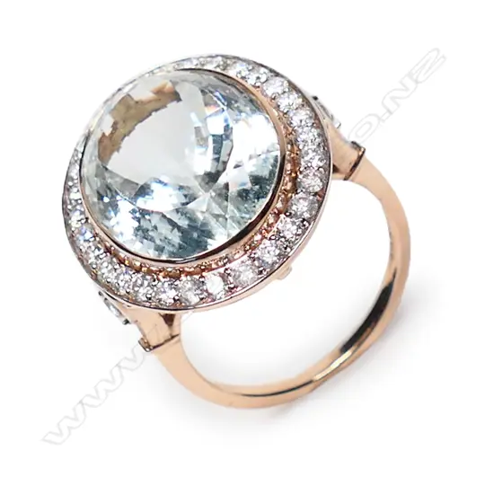 A 14ct rose gold aquamarine and diamond halo cocktail ring,