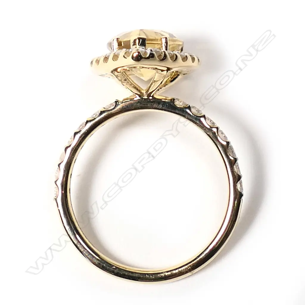 A 14ct gold heliodor and diamond halo ring, Image 1++