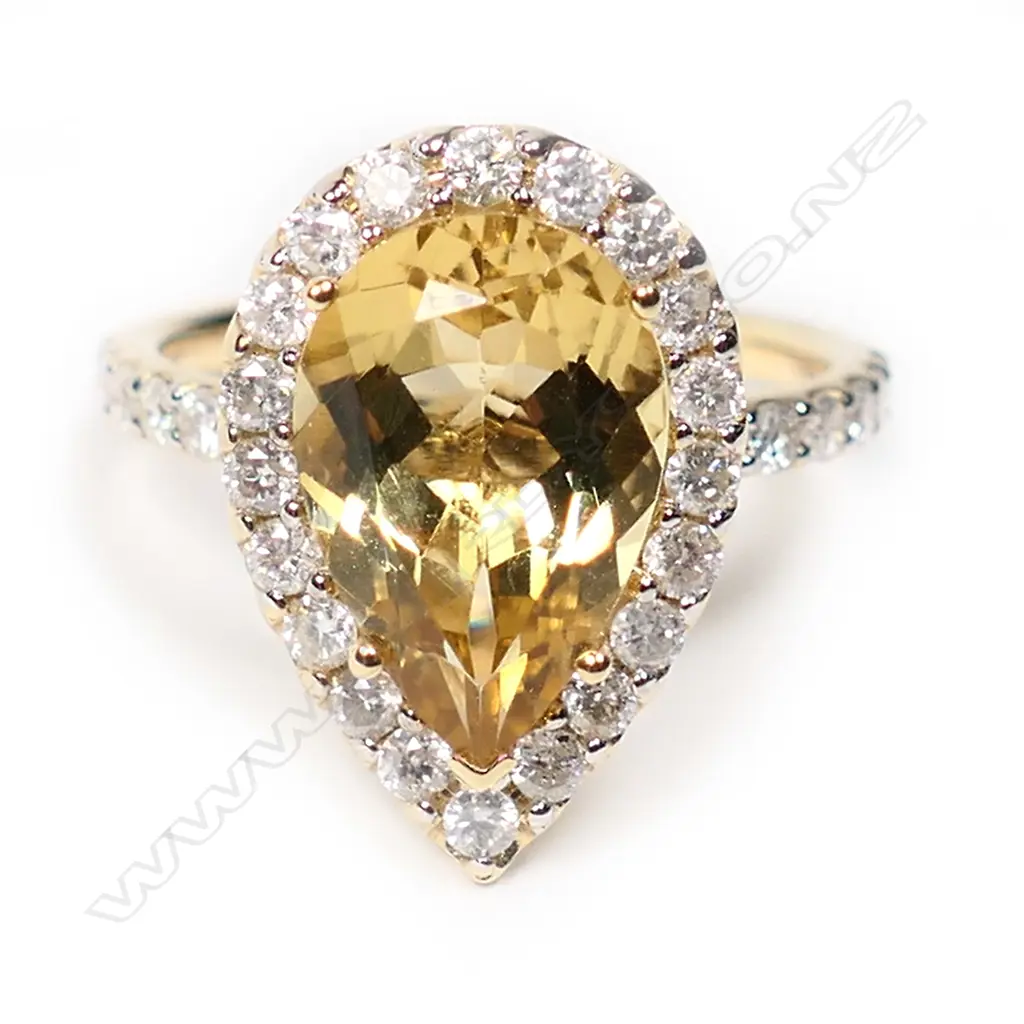 A 14ct gold heliodor and diamond halo ring, Image 1++