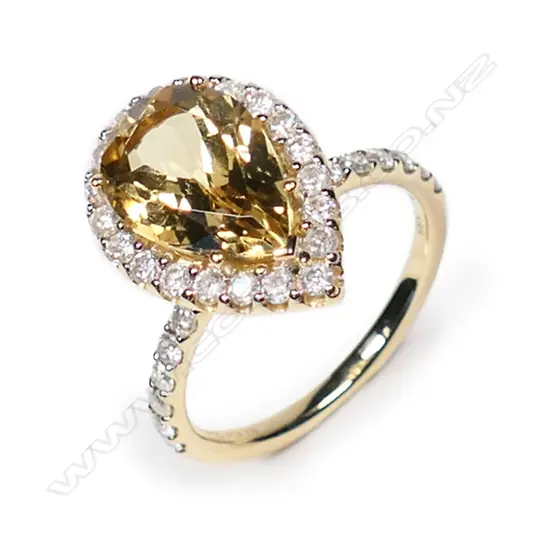 A 14ct gold heliodor and diamond halo ring,