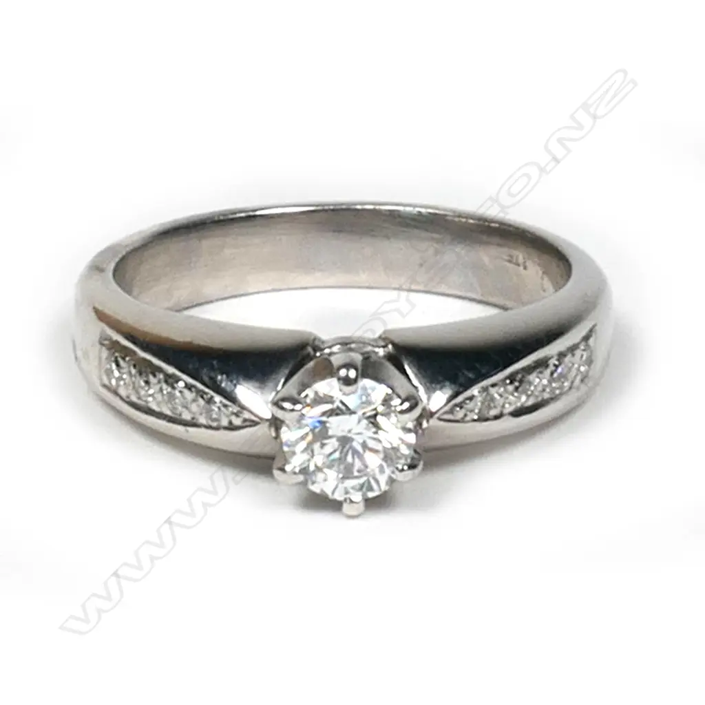 A 9ct white gold and diamond solitaire ring, Image 1++