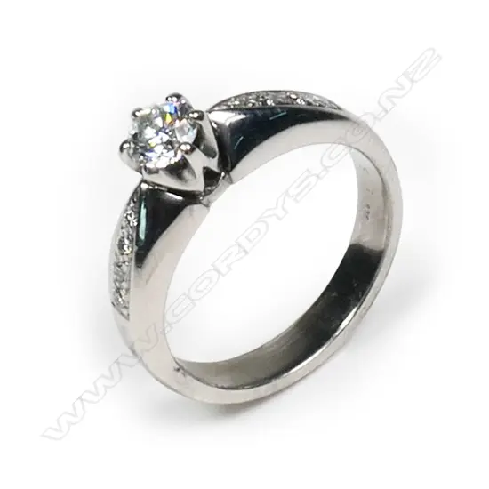 A 9ct white gold and diamond solitaire ring,