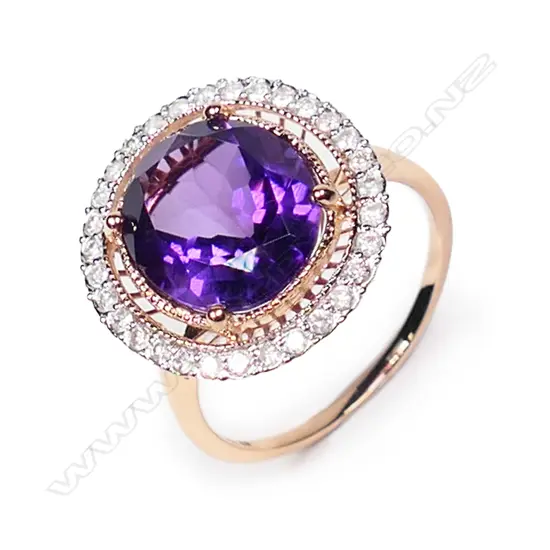 A 14ct rose gold, amethyst and diamond halo cocktail ring,