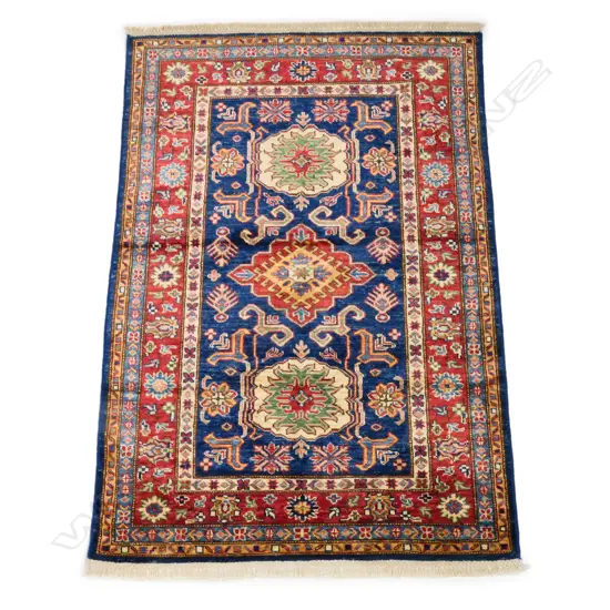 A tribal Kazak rug, hand knotted wool pile,