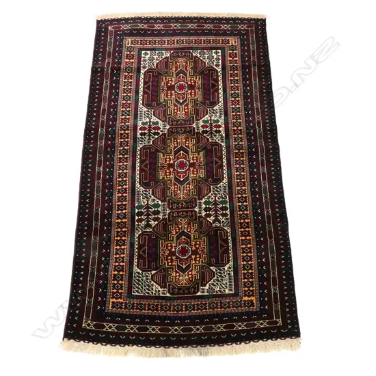 A Balouch hand knotted tribal rug,