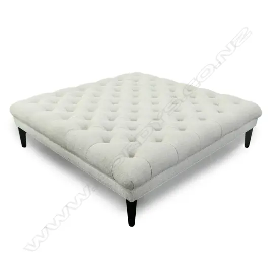 A large modern square ottoman,