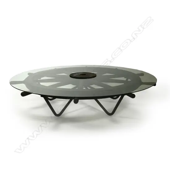 A large antique ten spoke ship's wheel,