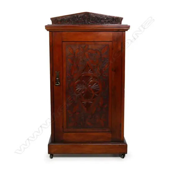 An early NZ kauri chipped carved music cabinet,