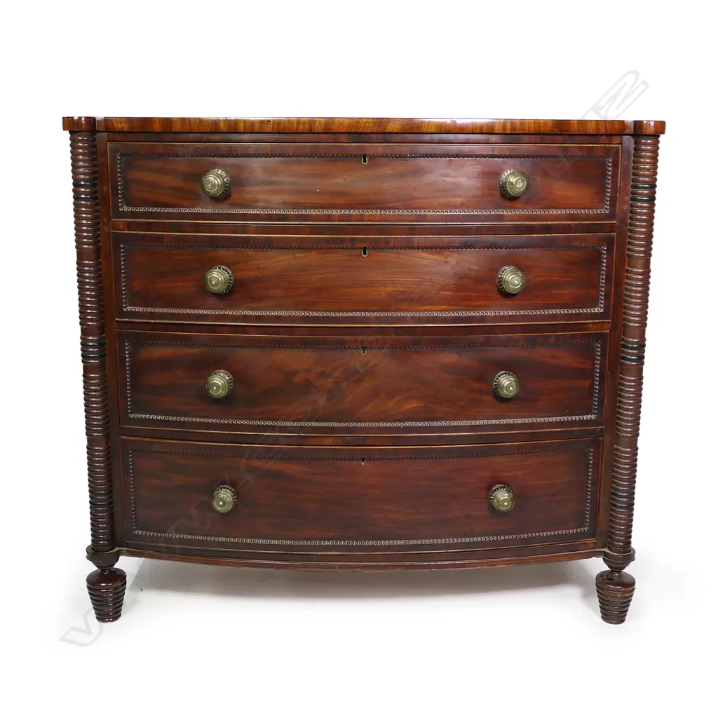 A fine William IV mahogany four drawer bow front chest, Image 1++