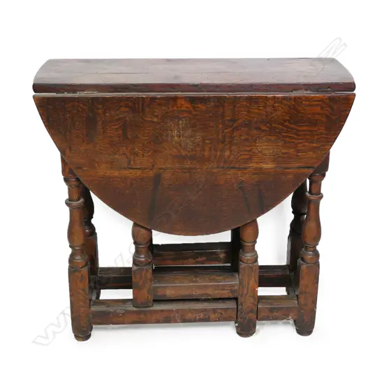 A Georgian oak gate leg table,