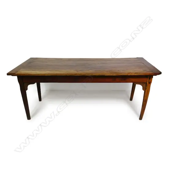 A 19thC French provincial fruit wood dining table,