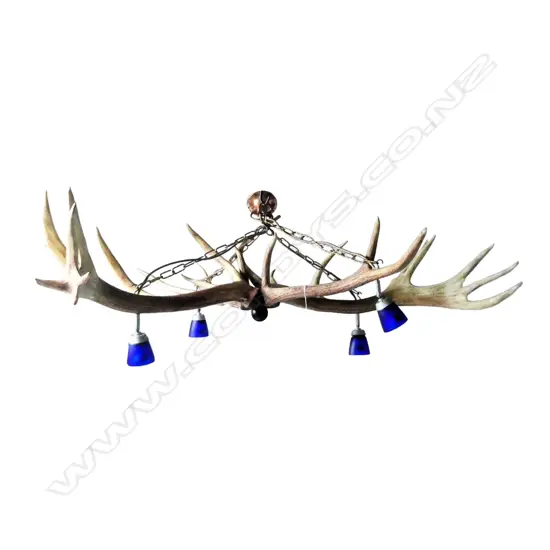 A large four-way deer antler chandelier, with twenty-five points,
