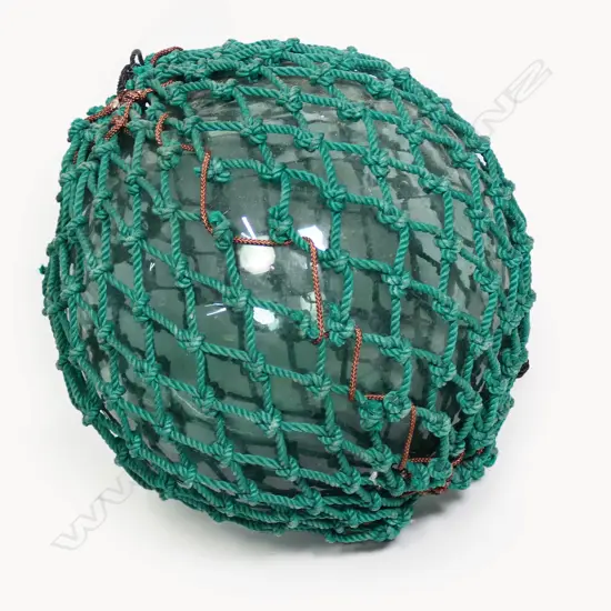 An old Japanese glass fishing float,