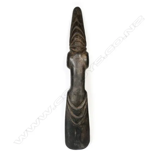 A large and decorative ceremonial adze blade,