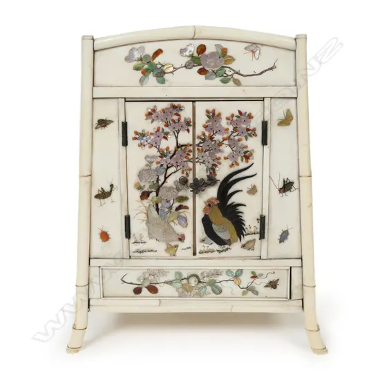 A Japanese late Meiji period ivory miniature cabinet,