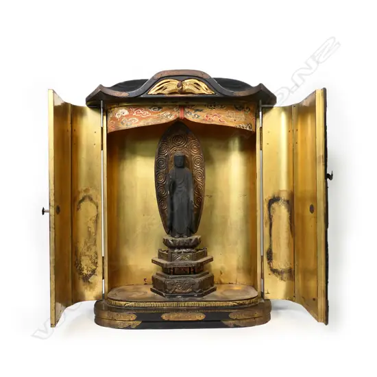 A 19thC wooden Amida buddha in a lacquered and gilded reliquary cabinet,