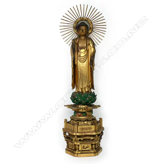 An early 20thC carved and gilded cypress wood Amida Buddha statue,