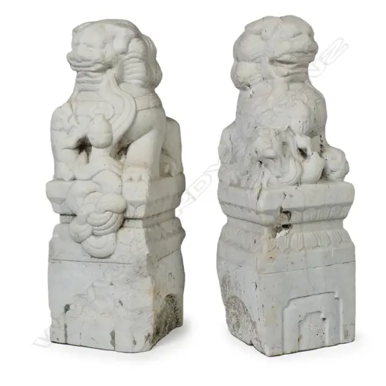 A pair of Qing period Chinese marble temple lions carved as newel post finials