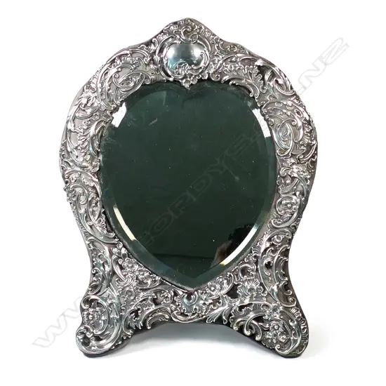 A large Edwardian silver dressing table mirror, with easel back