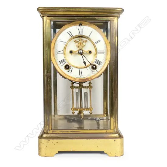 A 19thC American brass and four-glass mantel clock