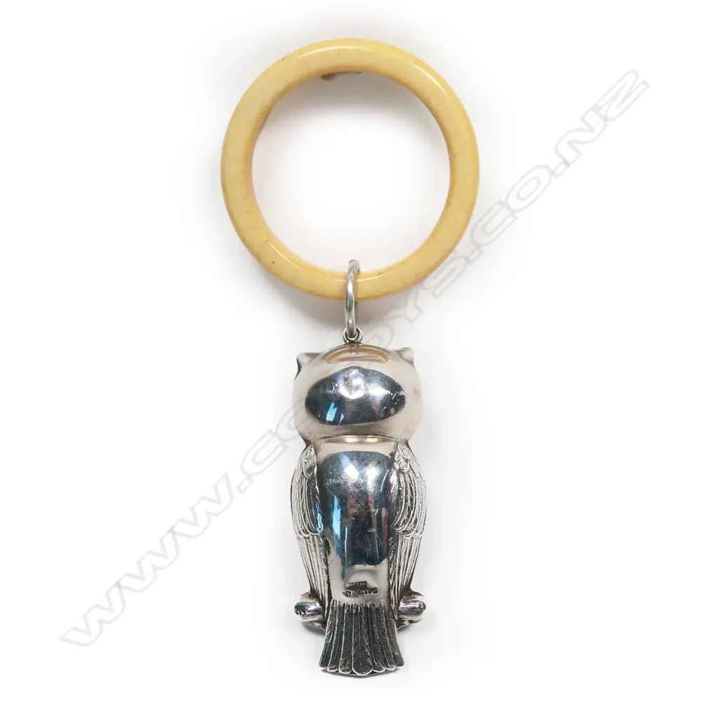 A silver baby teething ring, Image 1++
