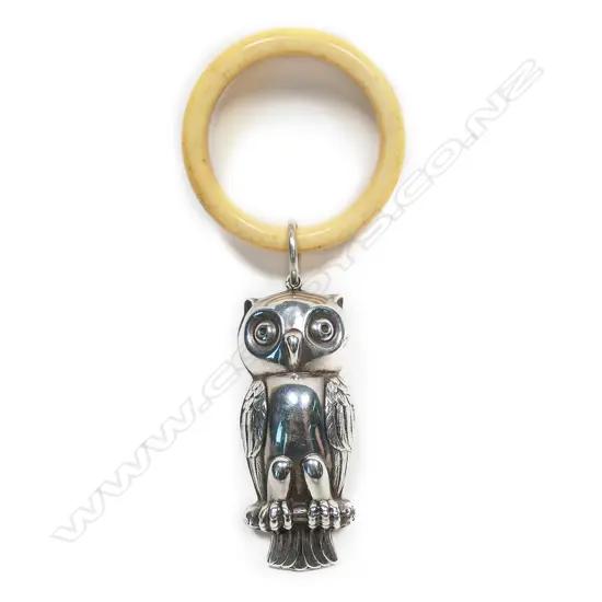 A silver baby teething ring,