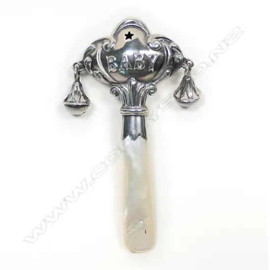 An early 1900s silver and mother of pearl baby rattle,