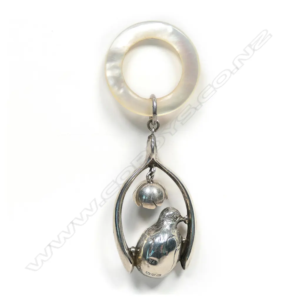 An early 1900s silver and mother of pearl baby rattle, Image 1++