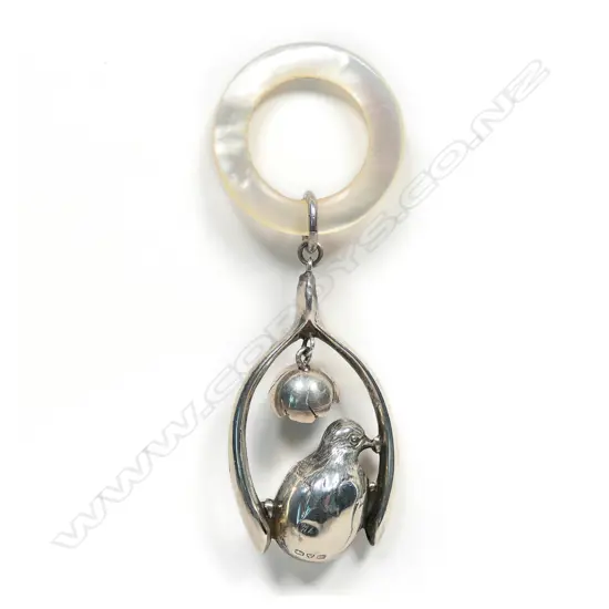 An early 1900s silver and mother of pearl baby rattle,