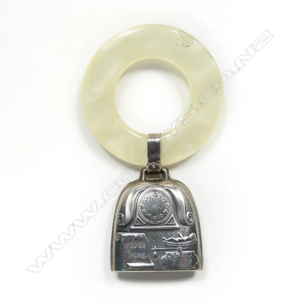 A mid 20thC silver and simulated mother of pearl baby rattle, Image 1++