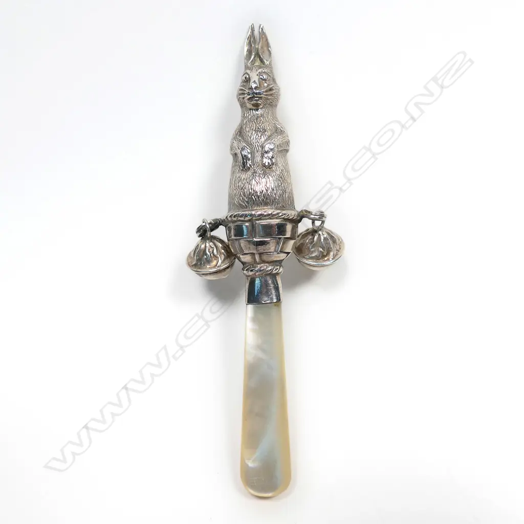 A 20thC silver and mother of pearl baby rattle, Image 1++