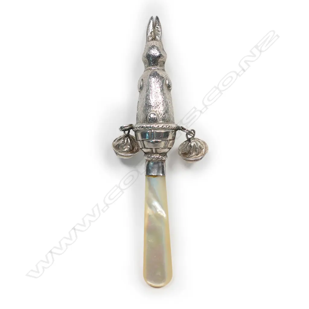 A 20thC silver and mother of pearl baby rattle, Image 1++