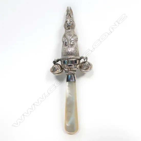A 20thC silver and mother of pearl baby rattle,