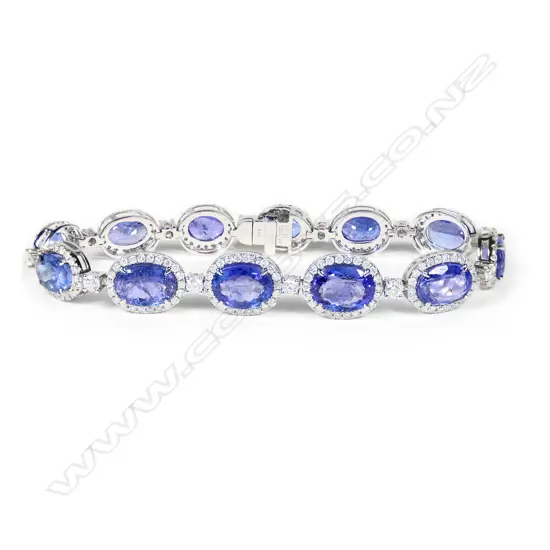 A platinum, tanzanite and diamond halo bracelet,