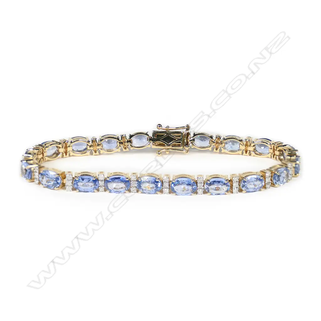 A 14ct gold, Ceylon sapphire and diamond line bracelet, Image 1++
