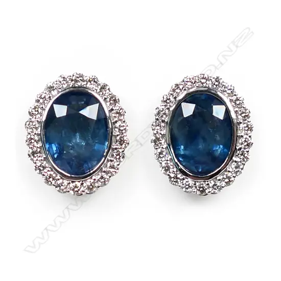 A pair of 14ct white gold, sapphire and diamond halo earrings,