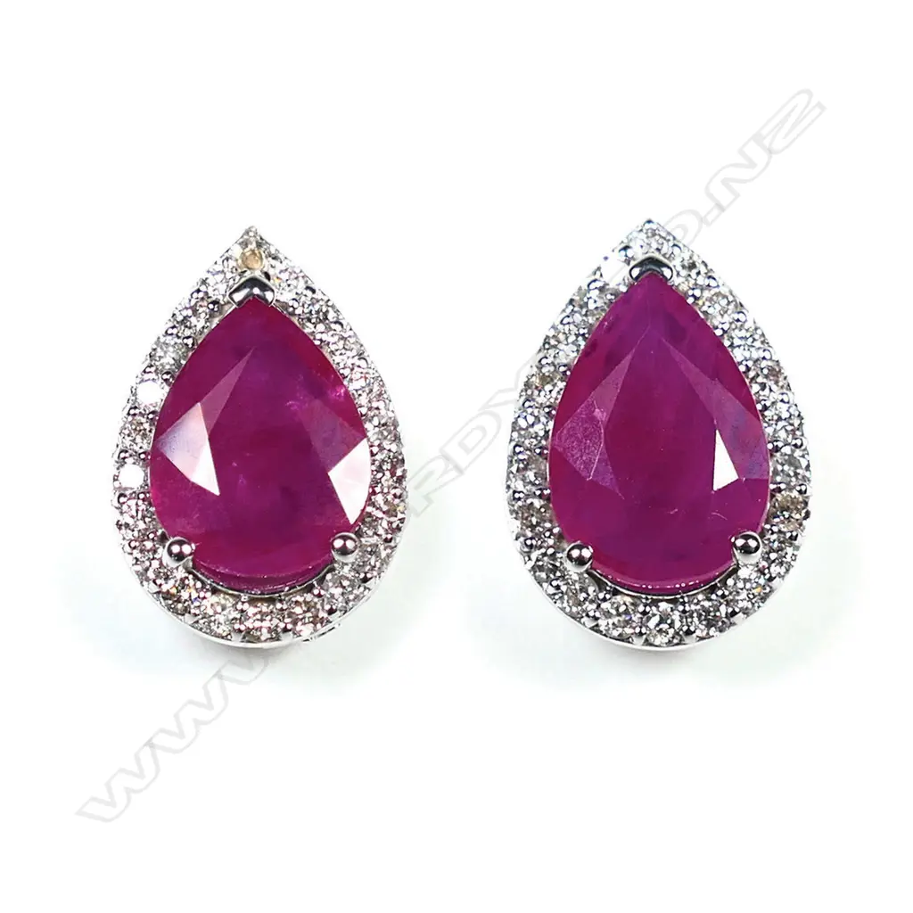 A pair of 14ct white gold ruby and diamond halo stud earrings, Image 1++