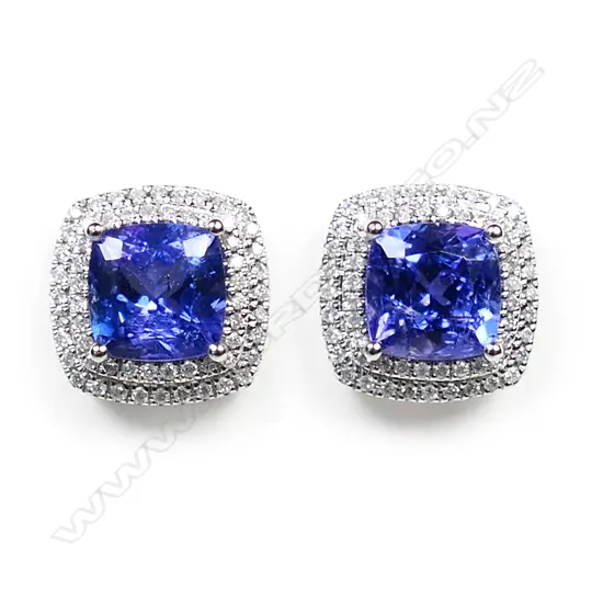 A pair of 14ct white gold, tanzanite and diamond double halo stud earrings,