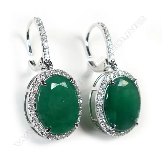 A pair of 14ct white gold, emerald and diamond drop earrings,