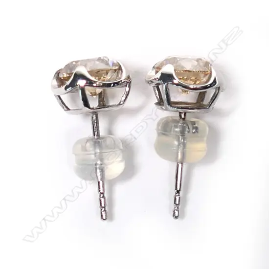 A pair of 18ct white gold and diamond stud earrings,