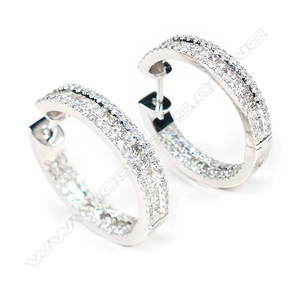 A pair of 18ct white gold and diamond earrings, Image 1++