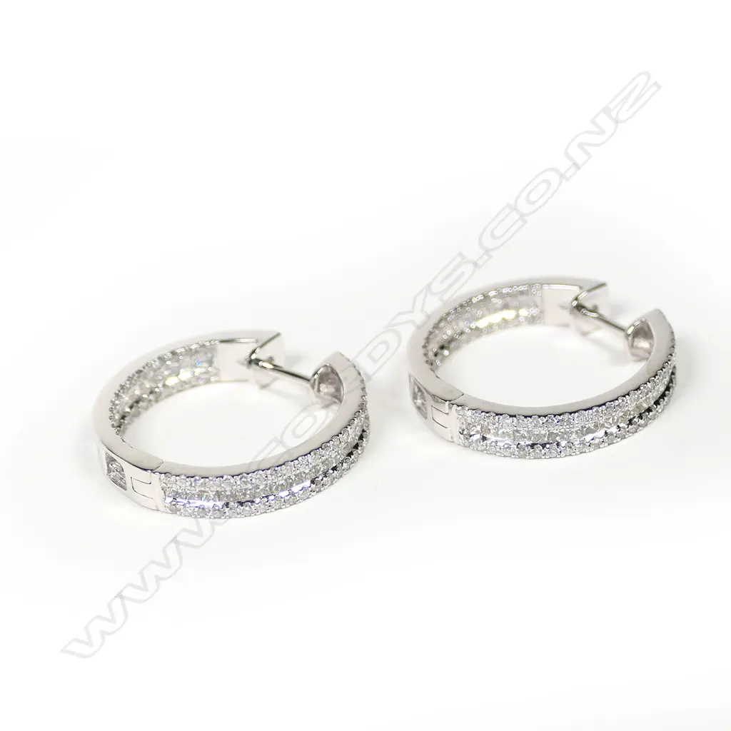 A pair of 18ct white gold and diamond earrings, Image 1++